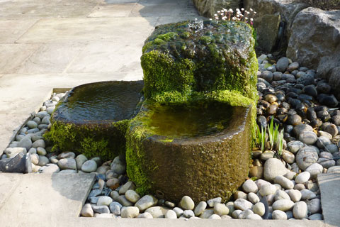 Stone trough used as water feature